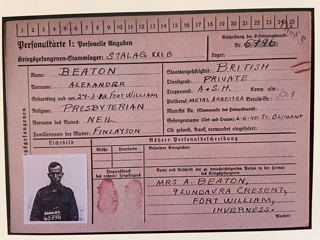 Printed identification document containing a photograph of Beaton
